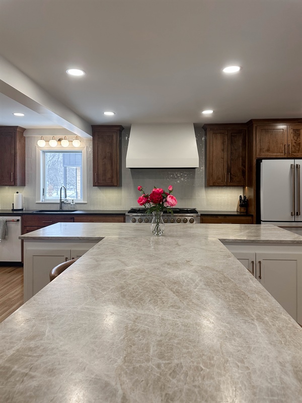 Custom T-shaped kitchen island with quartzite countertops in Hopkins, MN remodel
