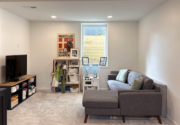 Finished basement recreation room with egress window in Hopkins, MN