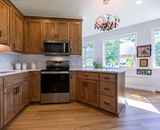 Custom kitchen with wood cabinetry and peninsula in Dayton, MN ADU addition