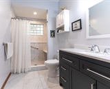 Accessible bathroom with walk-in shower and grab bar in Dayton, MN ADU addition